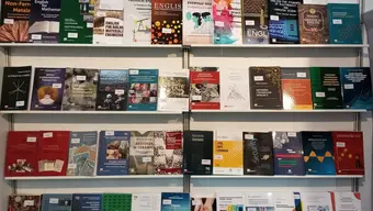 Image of some books published by the AGH University Press displayed in four rows