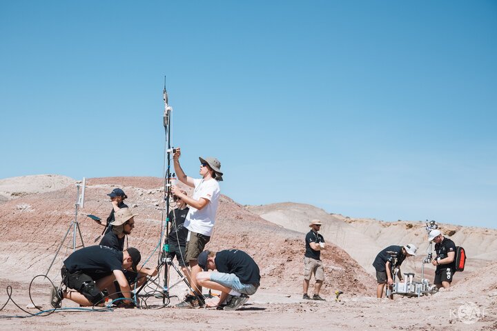 Image of a team working at a station