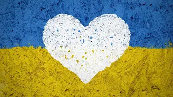 Image of the Ukrainian flag with a white heart in the middle of it