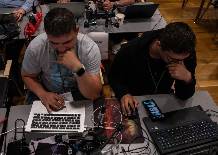 Image of developers at work, programing on their laptops